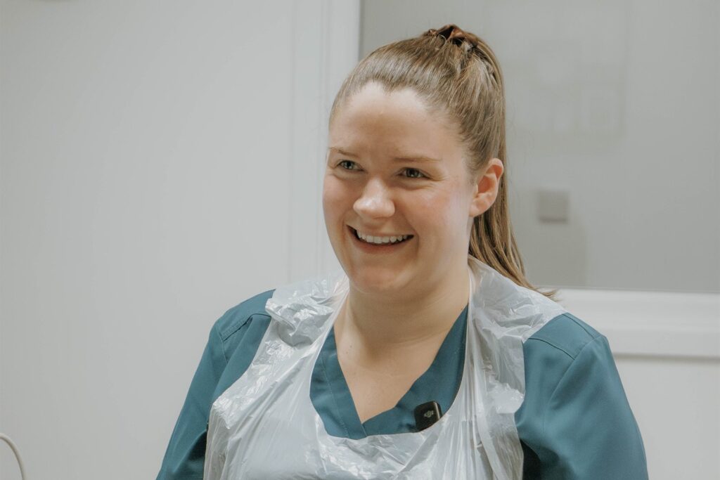 Lucy Kelly, Owner and Principal Podiatrist, treating a patient